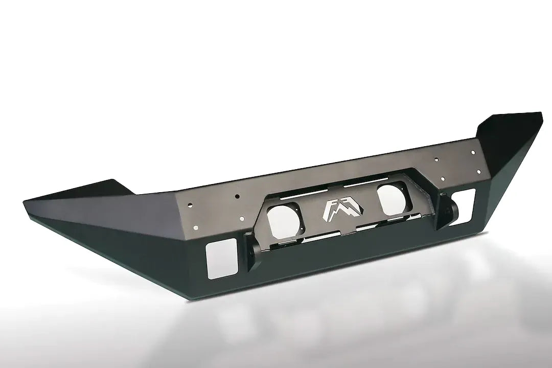 Fab Fours Full Metal Jacket full-width front bumper in black powder coat, angle view, showing the wing-style end caps, light openings and Fab Fours logo cutout