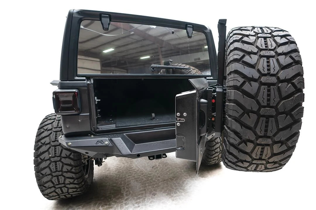 Fab Fours Off-The-Door Tire Carrier on a Jeep Wrangler JL, rear view with the tailgate open