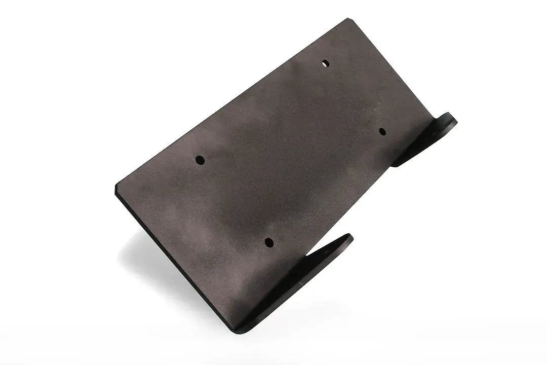 Fab Fours winch plate in black powder coat, angled view, showing the flat mounting plate with a four-bolt winch pattern and two angled side mounting tabs