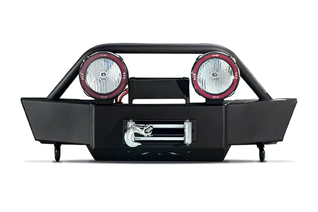 Fab Fours winch mount front bumper for 2007–2013 Toyota Tundra in matte black, front view showing the pre-runner guard, two round off-road lights, center winch with roller fairlead and hook, and D-ring shackles on a white background
