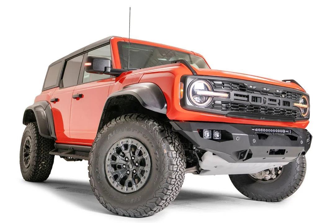 Fab Fours Matrix front bumper on an orange Ford Bronco Raptor, passenger-side front three-quarter view