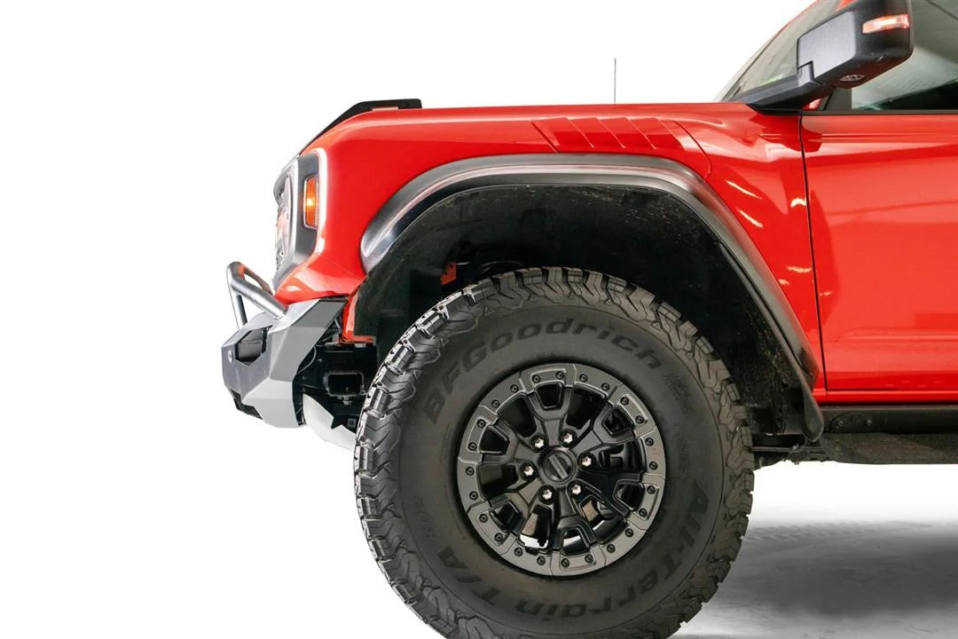 Fab Fours Matrix front bumper with pre-runner guard on an orange Ford Bronco Raptor, driver-side profile view of the bumper