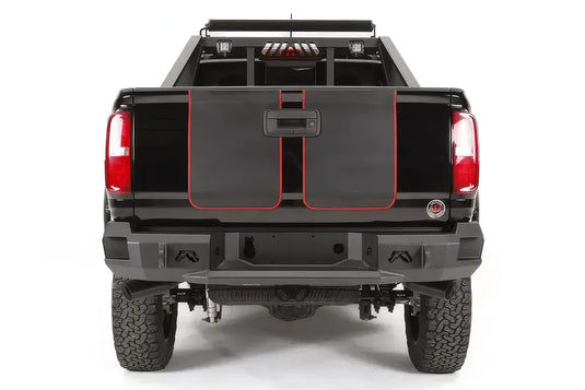 Fab Fours Premium rear bumper on a lifted black Chevrolet Colorado, straight rear view