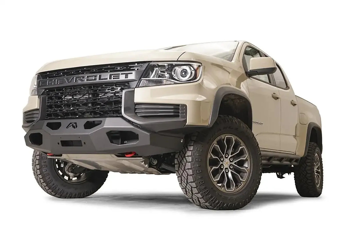 Fab Fours hidden winch mount on a tan Chevrolet Colorado ZR2, passenger-side front three-quarter view