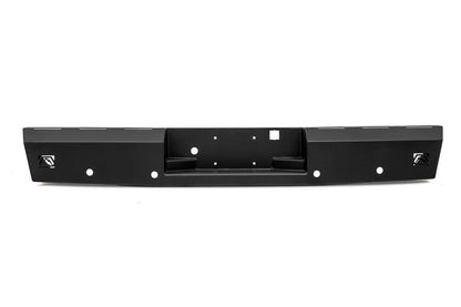 Fab Fours Red Steel rear bumper in black powder coat, straight-on view, showing the recessed center step, license plate mounting holes and Fab Fours logo plates