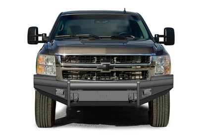 Fab Fours Black Steel Elite front bumper on a dark gray Chevrolet Silverado 2500HD, straight-on front view, showing the smooth-plate bumper face, center tube uprights and mesh light openings