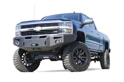 Fab Fours Premium heavy-duty winch front bumper on a lifted black Chevrolet Silverado 2500HD, driver-side front three-quarter view