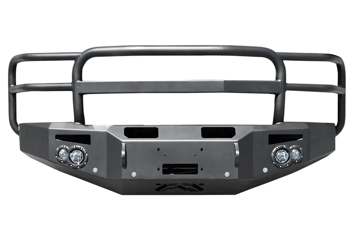 Fab Fours Premium Winch front bumper with full guard in black powder coat, front view, showing the full grille guard hoops, center winch plate, round light cutouts and shackle mounts