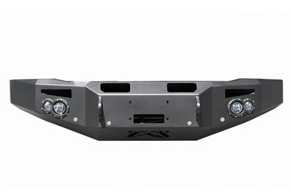 Fab Fours Premium Winch front bumper in black powder coat, front view, showing the center winch plate and fairlead opening, round light cutouts and shackle mounts