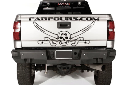 Fab Fours Premium rear bumper on a silver GMC Sierra 2500HD, straight-on rear view, showing the license plate recess, square light cutouts, shackle mounts and hitch receiver