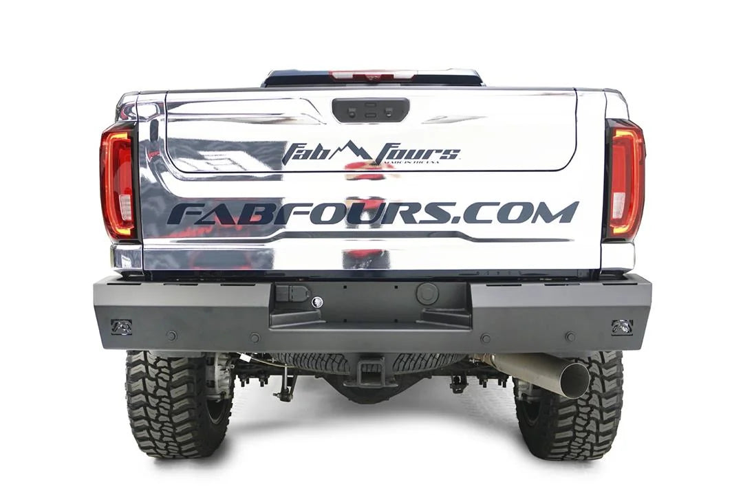 Fab Fours Red Steel rear bumper on a chrome-wrapped GMC Sierra HD, straight-on rear view, showing the flat bumper face, integrated light cutouts, license plate recess and hitch opening