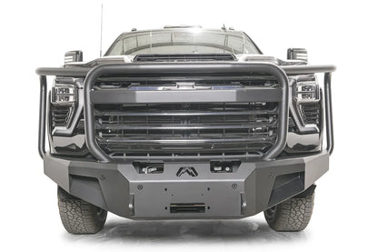 Fab Fours Premium Winch front bumper with full guard on a dark gray Chevrolet Silverado 2500HD, straight-on front view, showing the full-width tubular guard, center winch fairlead opening and logo cutout