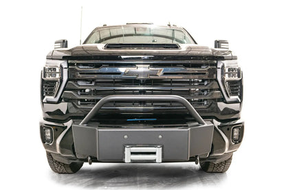 Fab Fours Winch Mount with pre-runner guard on a black Chevrolet Silverado 2500HD, straight-on front view, showing the pre-runner hoop, winch mount face and roller fairlead