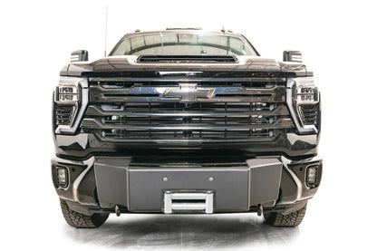 Fab Fours Winch Mount on a black Chevrolet Silverado 2500HD, straight-on front view, showing the no-guard winch mount face, roller fairlead and factory bumper integration