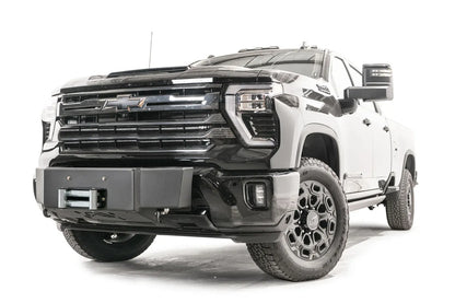 Fab Fours Winch Mount on a black Chevrolet Silverado 2500HD, front passenger-side three-quarter view, showing the no-guard winch mount, roller fairlead and factory fog light surround
