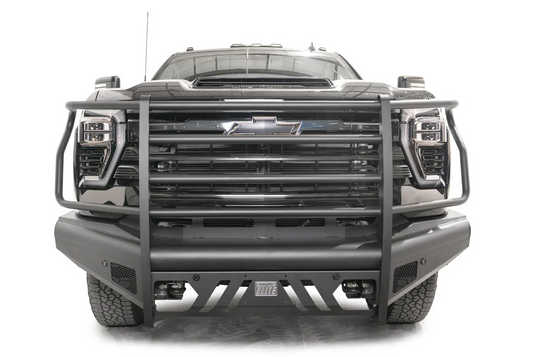 Fab Fours Black Steel Elite front bumper with full guard on a black Chevrolet Silverado 2500HD, straight-on front view, showing the full-width tubular guard, slotted center skid plate and pod light openings