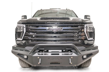 Fab Fours Red Steel front bumper with pre-runner guard on a black Chevrolet Silverado 2500HD, straight-on front view, showing the pre-runner hoop, center winch fairlead opening and shackle mounts