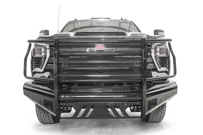 Fab Fours Black Steel front bumper with full guard on a black Chevrolet Silverado 2500HD, straight-on front view, showing the full-width mesh grille guard, red logo plate and diamond-plate skid plate