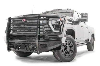 Fab Fours Black Steel front bumper with full guard on a black Chevrolet Silverado 2500HD, front driver-side three-quarter view, showing the mesh-filled full grille guard, diamond-plate face and slotted skid plate