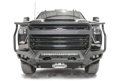 Fab Fours Matrix front bumper with full guard on a black Chevrolet Silverado 2500HD, straight-on front view, showing the tubular full grille guard, integrated light bar and winch fairlead
