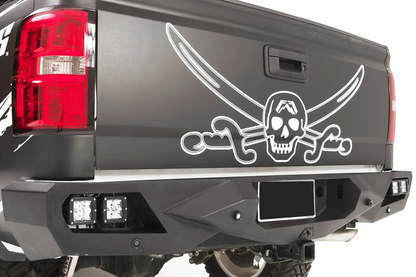 Fab Fours Vengeance rear bumper on a black and white wrapped pickup, close-up of the rear corner, showing the cube light pods, angular end cap and license plate recess