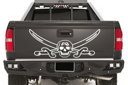 Fab Fours Vengeance rear bumper on a black and white wrapped pickup, straight-on rear view, showing the angular black steel face, cube light pods and center hitch area