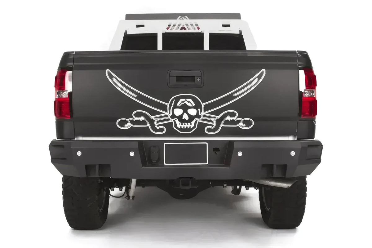 Fab Fours Premium rear bumper on a black and white wrapped pickup, straight-on rear view, showing the full-width black steel bumper, sensor cutouts and center hitch receiver