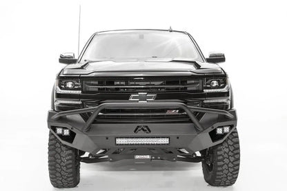 Fab Fours Vengeance front bumper with pre-runner guard on a black lifted Chevrolet Silverado 1500, straight-on front view, showing the tubular pre-runner hoop, center light bar and cube light pods