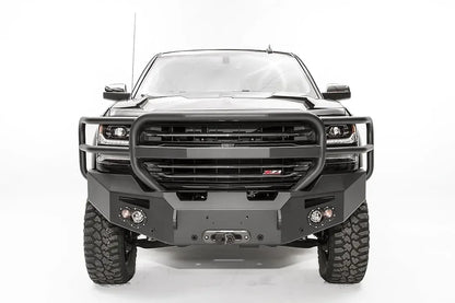 Fab Fours Premium front bumper with full guard on a black lifted Chevrolet Silverado 1500, straight-on front view, showing the tubular full grille guard, winch fairlead opening and round light cutouts