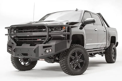 Fab Fours Premium front bumper with full guard on a black lifted Chevrolet Silverado 1500, front driver-side three-quarter view, showing the tubular full grille guard, winch mount and angled end wing