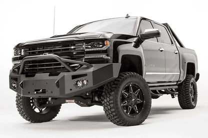 Fab Fours Premium front bumper with pre-runner guard on a black lifted Chevrolet Silverado 1500, front driver-side three-quarter view, showing the tubular pre-runner hoop, winch mount and angled end wing