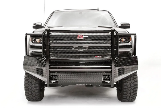 Fab Fours Black Steel front bumper with full guard on a black lifted Chevrolet Silverado 1500, straight-on front view, showing the full-width mesh grille guard, diamond-plate face and red logo plate