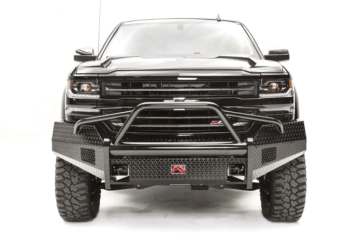 Fab Fours Black Steel front bumper with pre-runner guard on a black Chevrolet Silverado 1500, straight-on front view, showing the pre-runner hoop, diamond-plate face, and integrated light cutouts