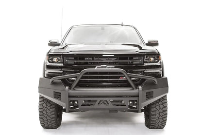 Fab Fours Elite front bumper with pre-runner guard on a black 2016–2018 Chevrolet Silverado 1500, front view showing the tubular hoop over the grille, honeycomb side vents and Fab Fours logo skid plate