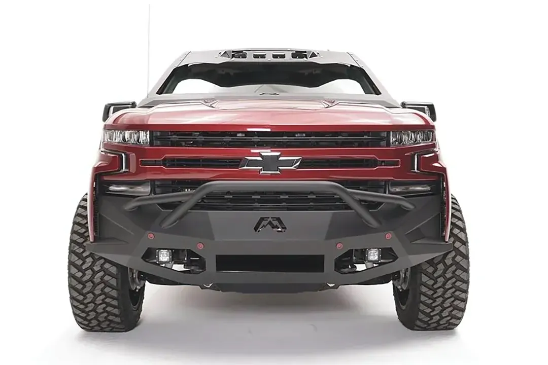 Fab Fours Vengeance front bumper with pre-runner guard on a red Chevrolet Silverado 1500, straight-on front view, showing the pre-runner hoop, center Fab Fours logo, and four light pods