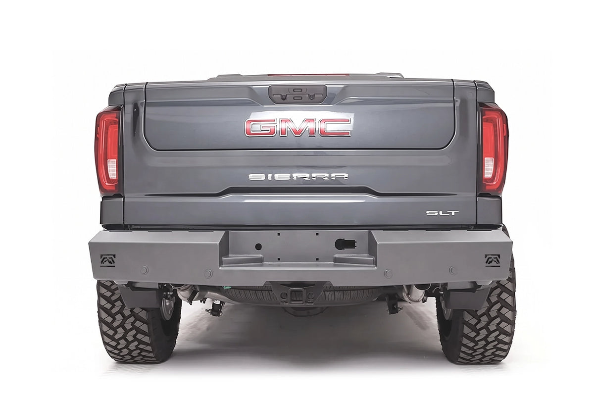 Fab Fours Red Steel rear bumper on a gray GMC Sierra 1500