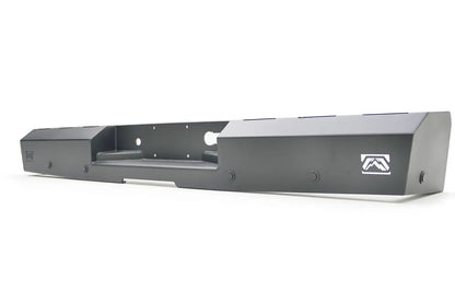 Fab Fours Red Steel rear bumper in black powder coat, angled view, showing the center hitch recess, end-cap Fab Fours logos, and mounting bolts