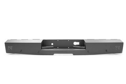 Fab Fours Red Steel rear bumper in black powder coat, straight-on rear view, showing the center plate and hitch recess, flat end sections, and Fab Fours logos