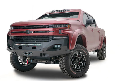 Fab Fours Matrix Front Winch Bumper on a lifted red Chevrolet Silverado 1500, front driver-side view, showing the slim no-guard profile, LED light bar and winch