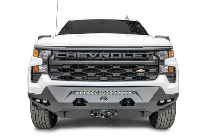 Fab Fours Matrix Front Bumper on a white 2022+ Chevrolet Silverado 1500, front view, showing the center LED light bar, two cube lights per side and the winch fairlead mount