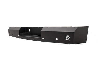 Fab Fours Red Steel rear bumper in black powder coat, opposite angled view, showing the hitch recess, logo end cap, and slotted top edge
