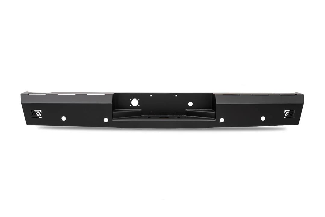 Fab Fours Red Steel rear bumper in black powder coat, straight-on rear view, showing the center hitch recess, logo end caps, and light cutouts