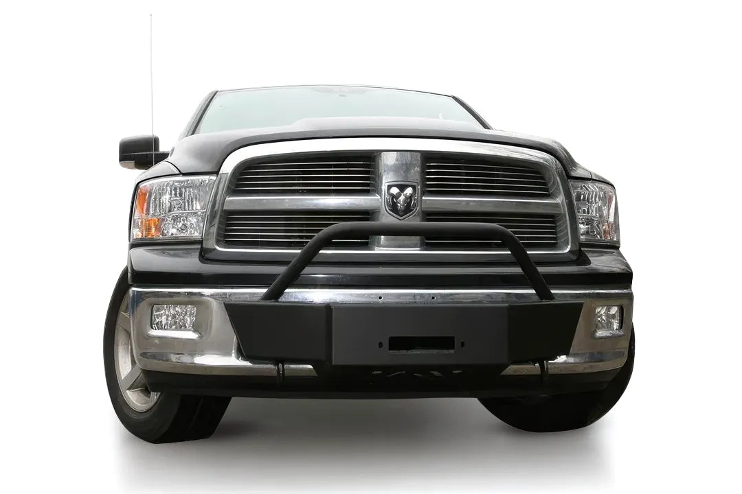 Fab Fours winch mount on a black Ram 1500, straight-on front view, showing the winch mount plate, tubular hoop, and fairlead opening