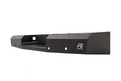 Fab Fours Red Steel rear bumper in black powder coat, opposite angled view, showing the hitch recess, logo end cap, and slotted top edge