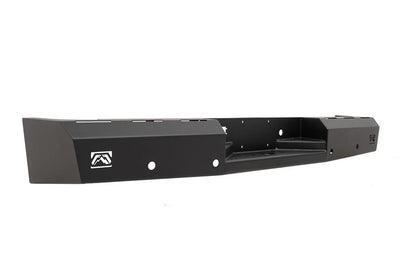 Fab Fours Red Steel rear bumper in black powder coat, angled view, showing the center hitch recess, logo end caps, and light cutouts