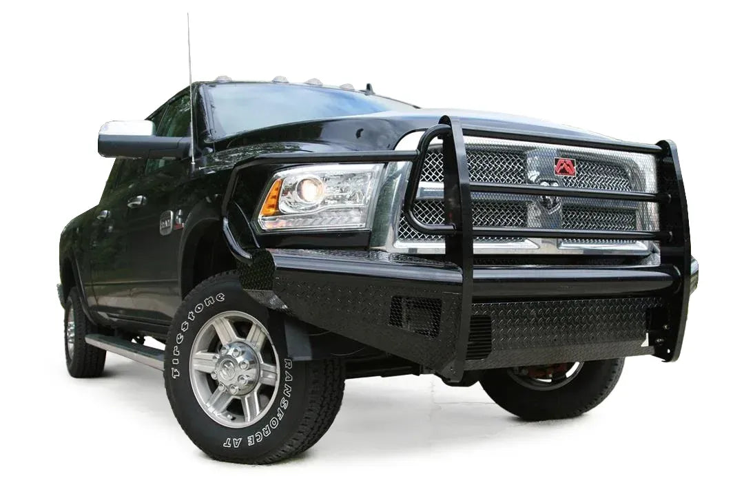 Fab Fours Black Steel front bumper with full guard on a black Ram 2500, front driver-side three-quarter view, showing the full grille guard, headlight hoops, and diamond-plate face