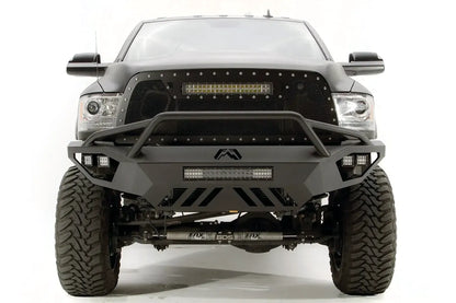 Fab Fours Vengeance front bumper with pre-runner guard on a gray Ram 2500, straight-on front view, showing the pre-runner bar, center LED light bar, and slotted skid plate