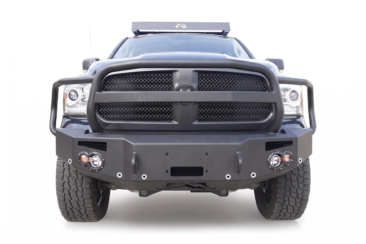 Fab Fours Premium winch front bumper with full grille guard on a black Ram 1500