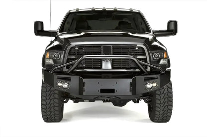Fab Fours Premium front bumper with pre-runner guard on a black Ram, straight-on front view, showing the pre-runner hoop, winch mount opening, round lights and D-ring mounts