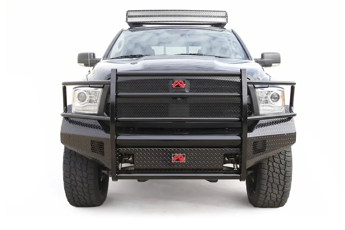 Fab Fours Black Steel diamond plate front bumper with full grille guard on a black Ram 1500